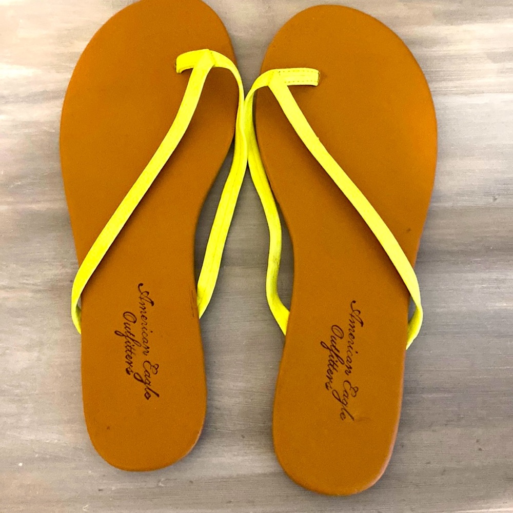 American Eagle neon yellow flip flops in size 6